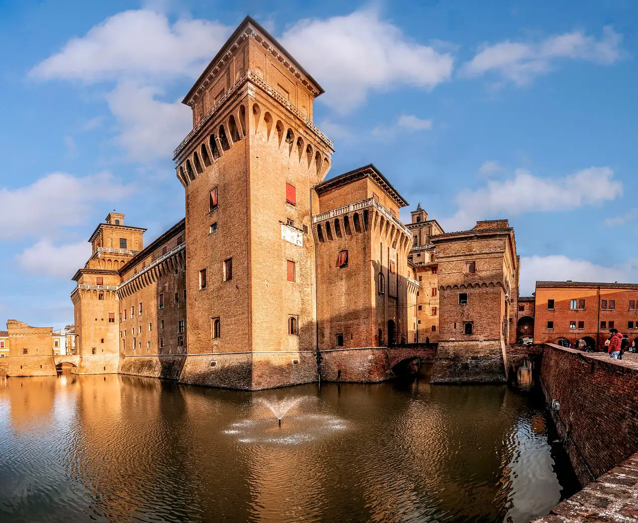 The moated Castello Estense with its four towers in Ferrara — the anchor sight of a ferrara day trip from padua