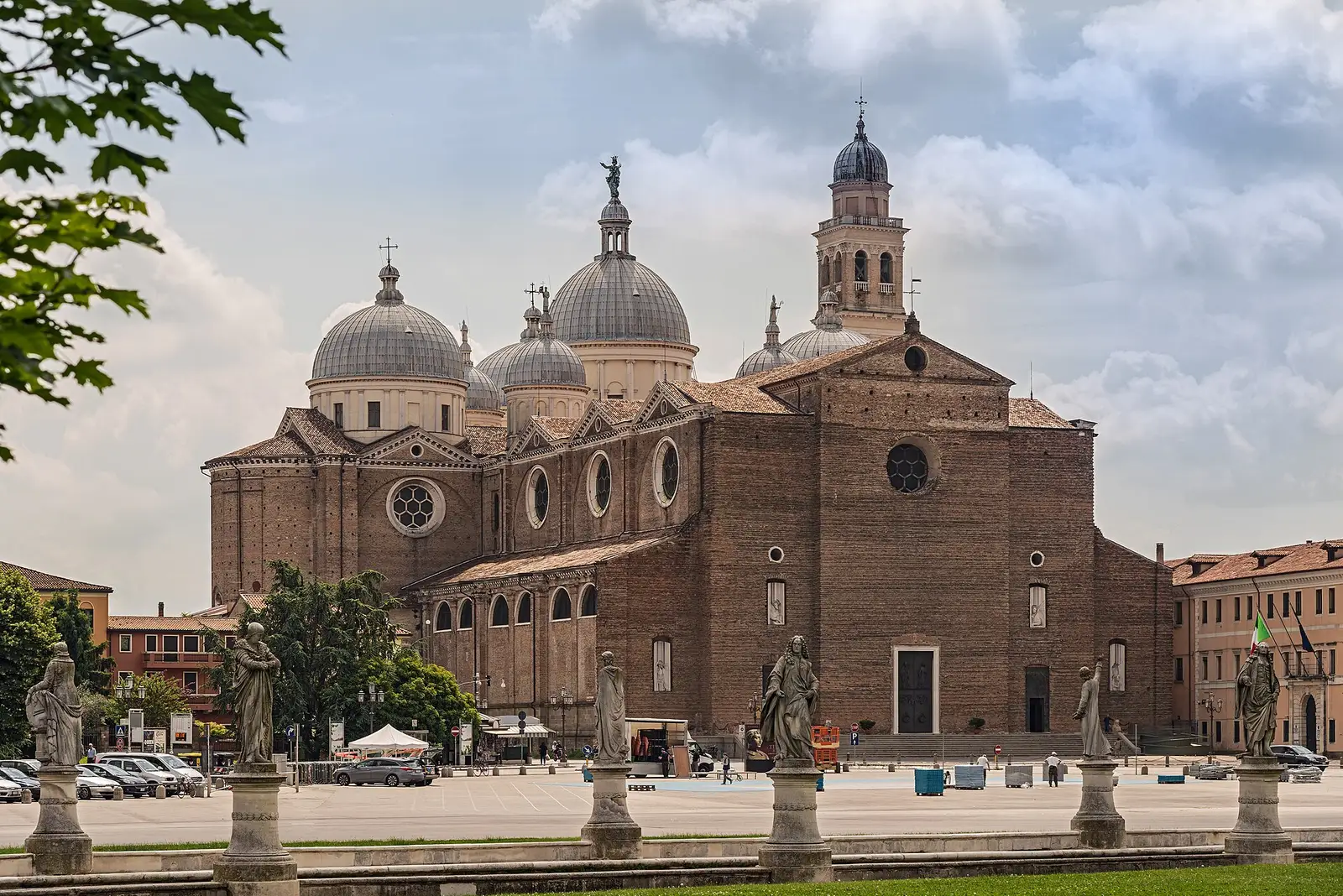 Huge facade and bell tower of the Abbey of Santa Giustina seen across Prato della Valle in Padua